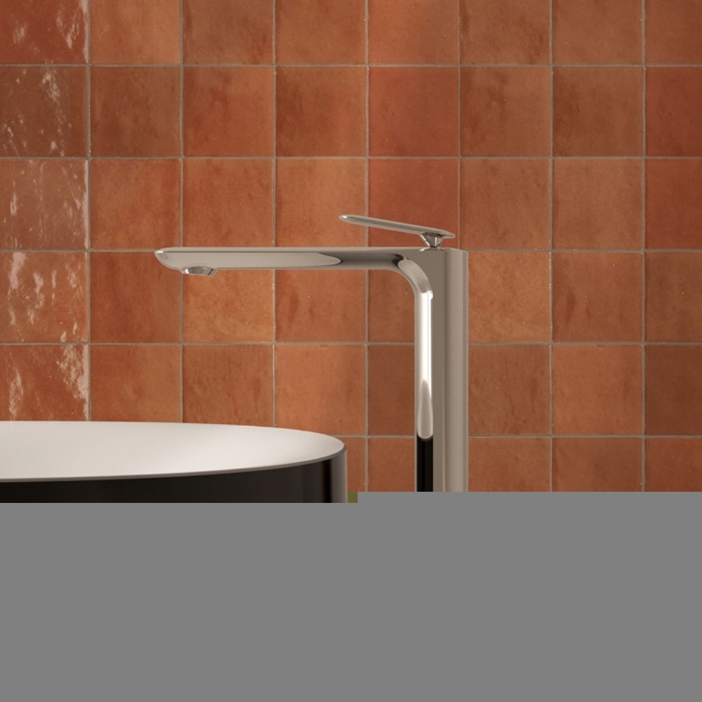 Lifestyle image of the Crosswater Huck Chrome Tall Basin Mixer mounted next to a round countertop basin